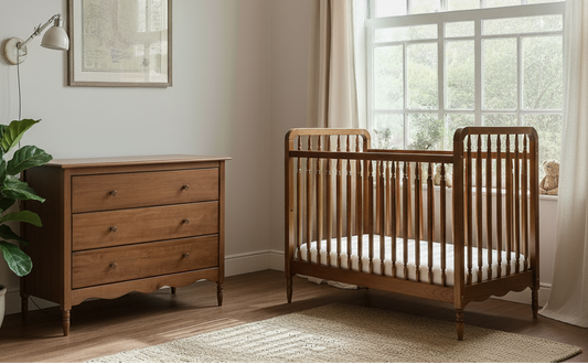 Nursery room with vintage wooden crib cot and dresser near a large window.